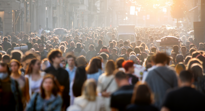 Crowded urban street filled with people, symbolizing the growing global demand for water due to population growth and urbanization