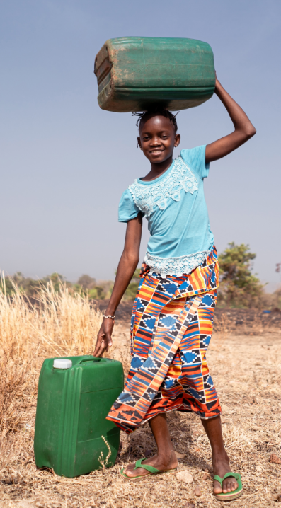 A girl carrying a heavy water container in a dry rural area, symbolizing the human cost and daily challenges of the global water crisis