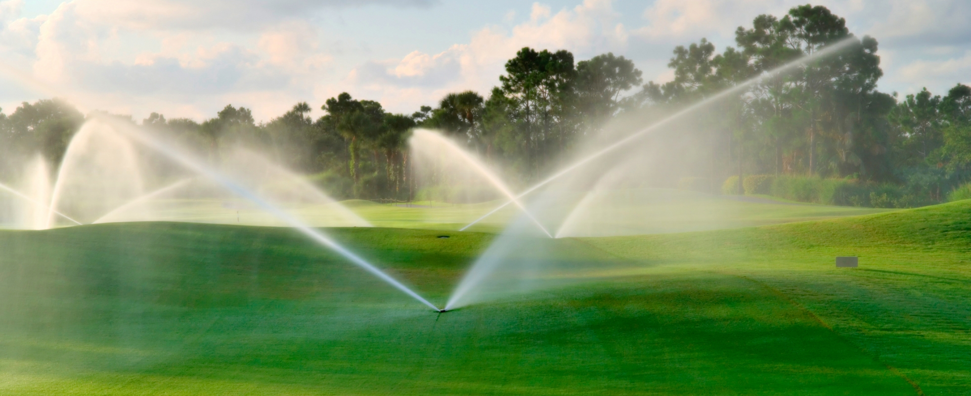 Irrigated green landscape representing Miracell RBC Technology for treated wastewater reuse in commercial and environmental applications