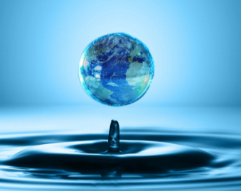 Globe emerging from a water ripple, symbolizing the far-reaching global impact of sustainable water solutions