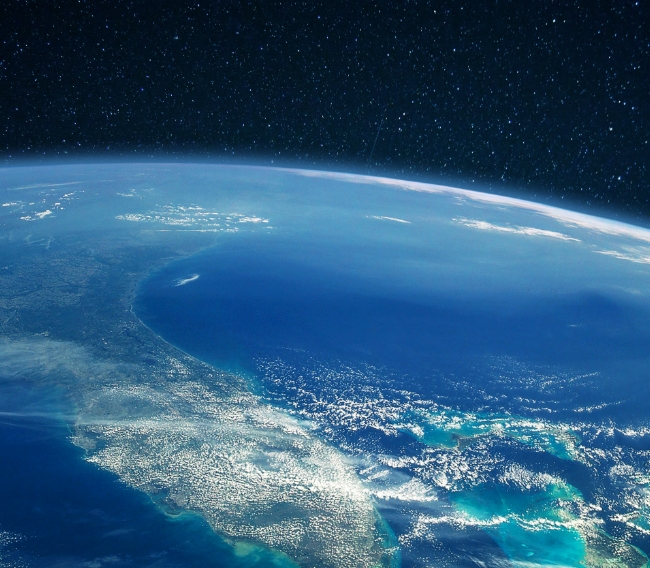 View of Earth from space symbolizing Rainmaker’s global reach and localized impact through clean water solutions
