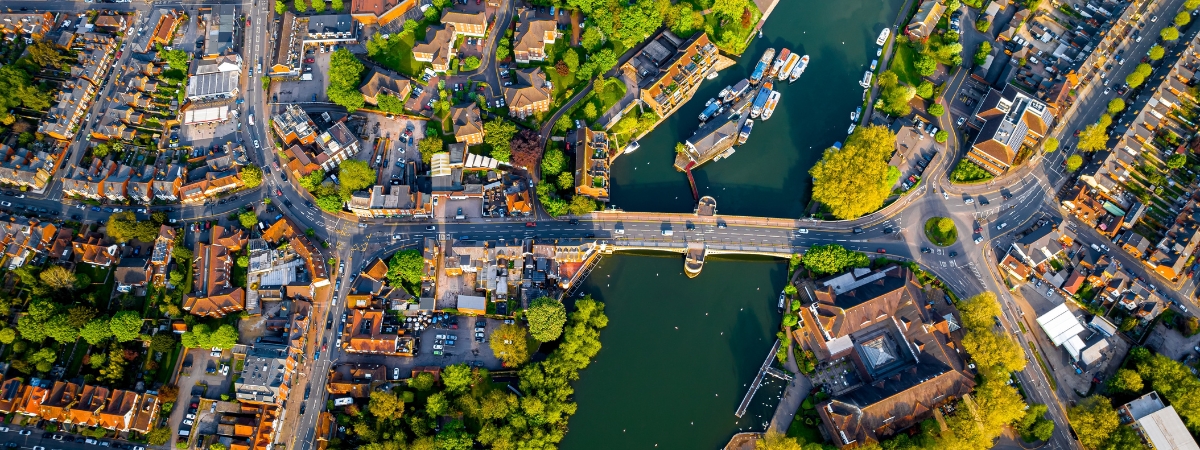 Aerial view of a growing community highlighting housing and infrastructure, representing how Miracell® RBC wastewater treatment expands municipal capacity sustainably.