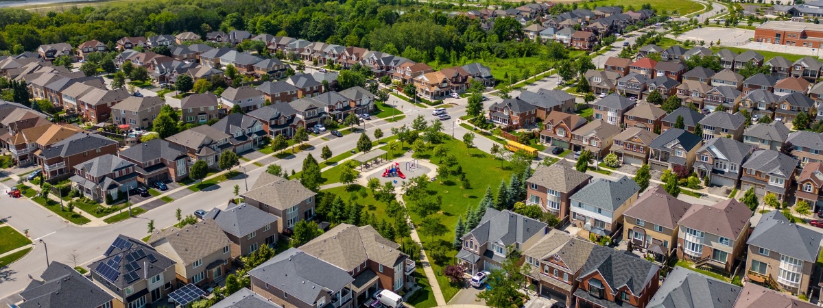 Aerial view of a residential housing development in Ontario, illustrating community growth and infrastructure demand relevant to decentralized wastewater planning.